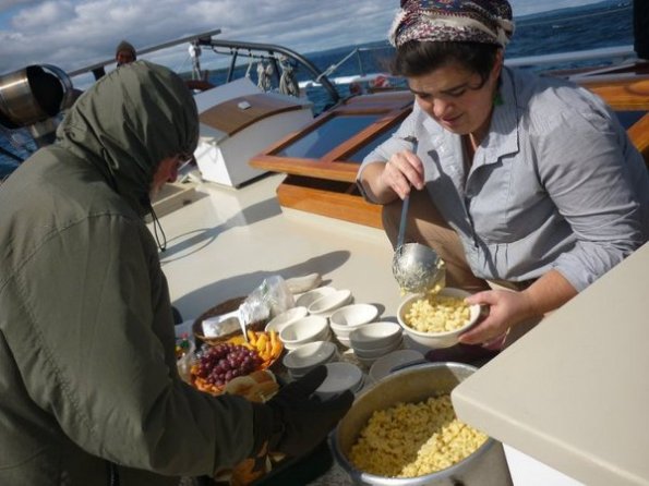 Lulu is dishing up macaroni and cheese for lunch.  Photo by Jin Newton