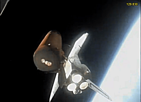 STS133 orbiter and fuel tank leaving the booster behind