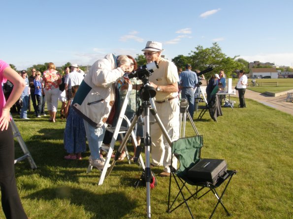 p6051257.jpg Bill Renis helping a person view the transit using the Lunt Solar Telescope. Photo by Eileen Carlisle.