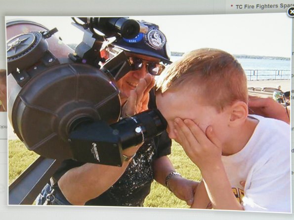 p6061305.jpg Gary Carlisle explaining explaining the transit to a young man viewing through his 8" telescope. Photo by Eileen Carlisle.