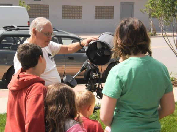 Here I am showing the kids how a telescope works.