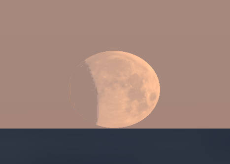 The partially eclipsed moon at moonset