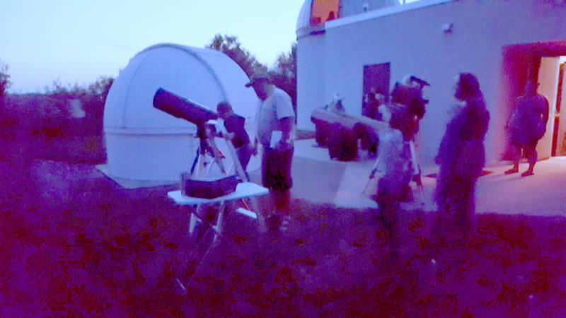 Telescopes setup behind the observatory for a star party
