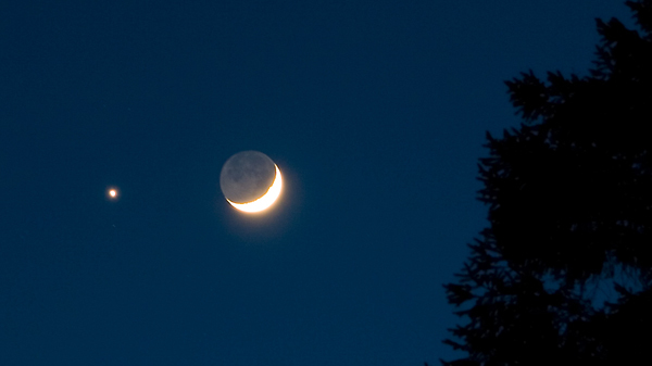 The waxing crescent Moon with earthshine and Venus
