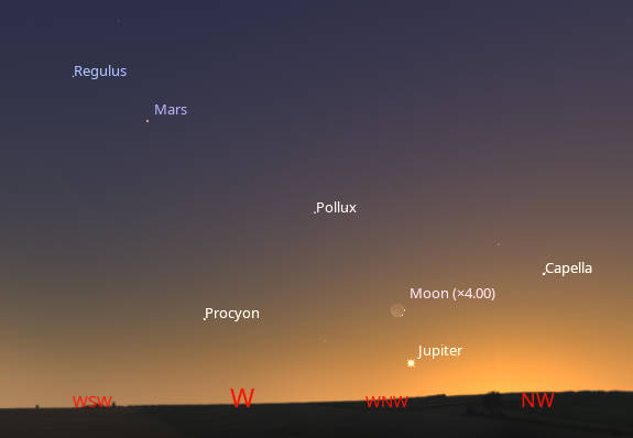The evening planets Jupiter and Mars seen with the fading stars of winter in bright twilight at 10 PM