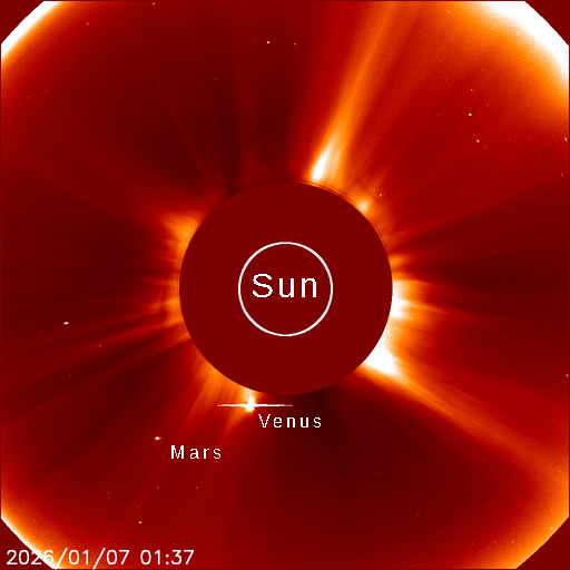 This this is a photograph of the Sun, Venus and Mars taken through the Solar and Heliospheric Observatory's (SOHO) C2 coronagraph.