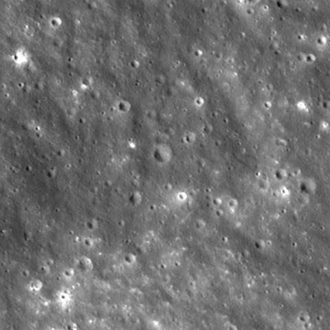 An animated GIF image of an area on the moon a quarter mile on a side, showing before and after photos of the area the Falcon 9 seccond stage crashed, and the crater it made. Photos were taken from NASA's Lunar Reconnaissance Orbiter.