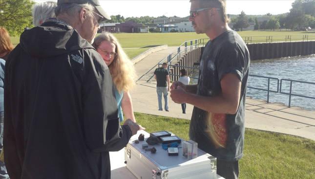 Joe Brooks talking to the public with part of his meteorite collection at the GTAS Transit of Venus event at the Traverse City, MI Open Space June 5, 2012.